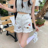 Sexy Jeansshorts mit Blumenstickerei und Quaste